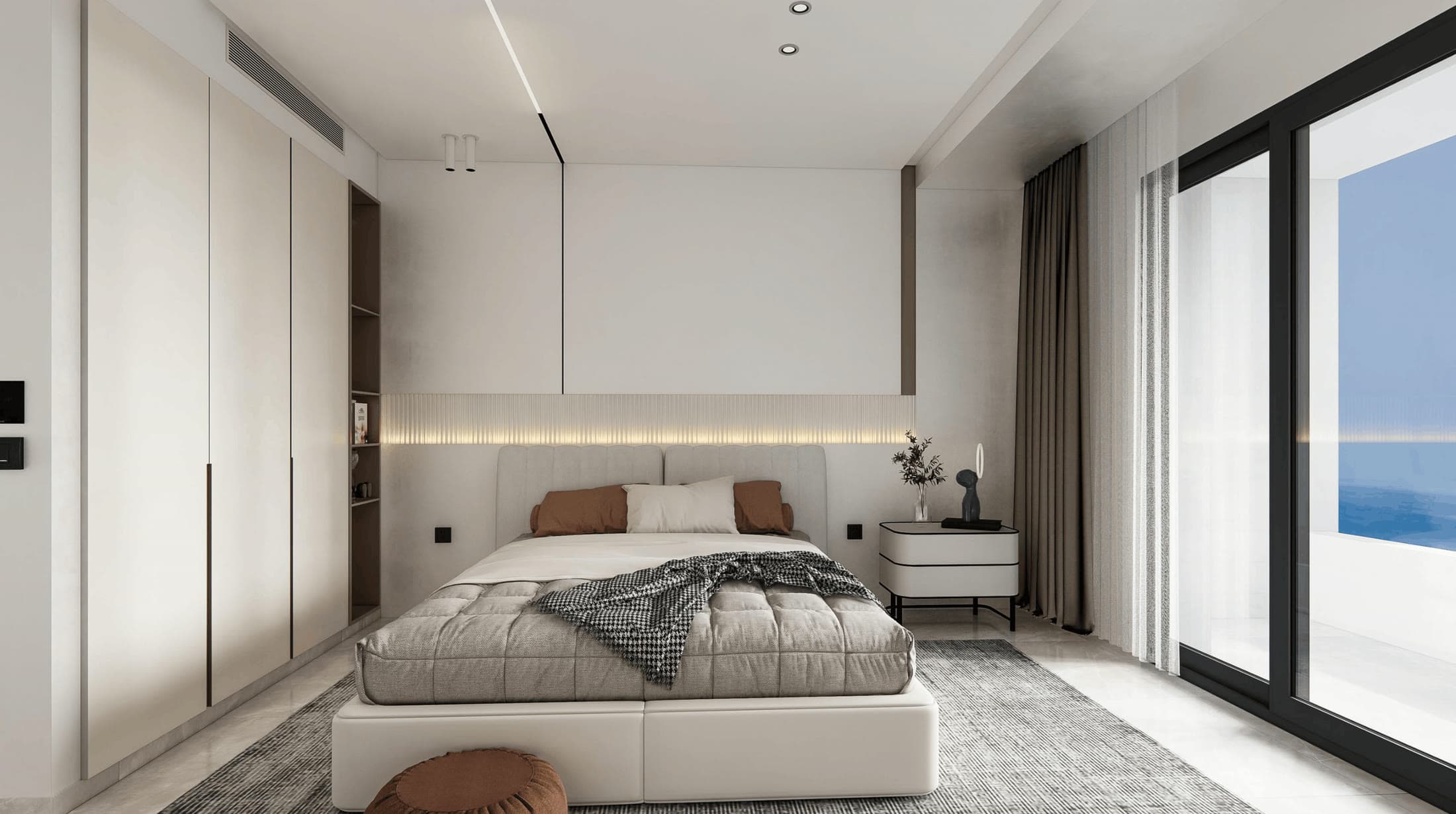 Chambre 2 de L’Arcane : lit double et baie vitrée ouverte sur la mer.